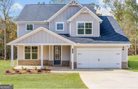 124 Chapman Ridge Rd, Macon, GA 31211 - craftsman-style home featuring covered porch, board and batten siding, a front lawn, and concrete driveway