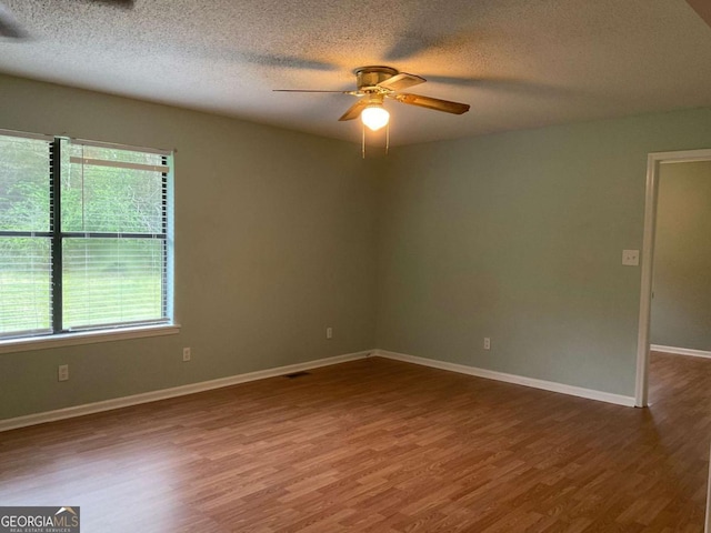 76 Jacqueline Dr, Georgetown, GA 39854 - unfurnished room with a ceiling fan, wood finished floors, and a textured ceiling