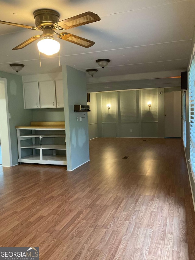 76 Jacqueline Dr, Georgetown, GA 39854 - unfurnished living room featuring wood finished floors and ceiling fan