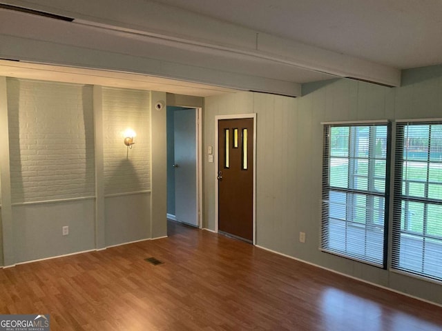 76 Jacqueline Dr, Georgetown, GA 39854 - spare room featuring wood finished floors and beam ceiling