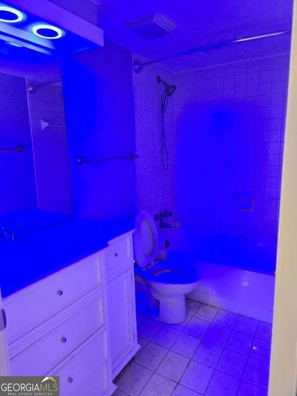full bathroom featuring toilet and walk in shower