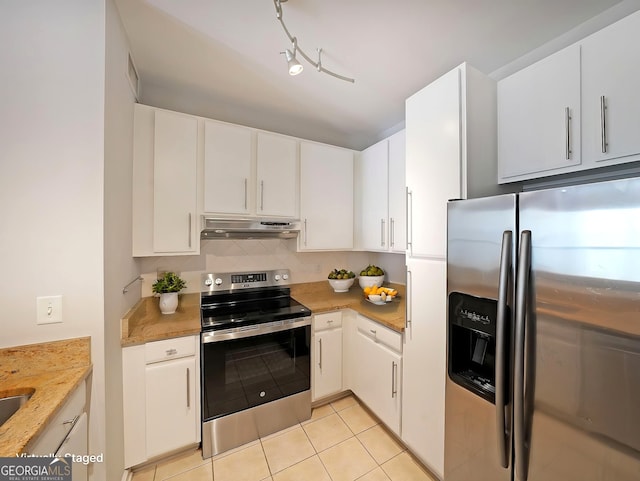 821 Ralph Mcgill Blvd NE Unit 3337, Atlanta, GA 30306 - kitchen featuring under cabinet range hood, light tile patterned floors, white cabinetry, and appliances with stainless steel finishes