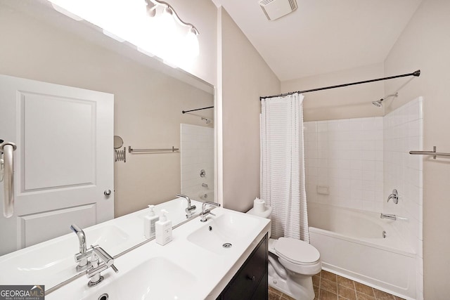 821 Ralph Mcgill Blvd NE Unit 3337, Atlanta, GA 30306 - bathroom featuring double vanity, toilet, visible vents, shower / bath combo with shower curtain, and a sink