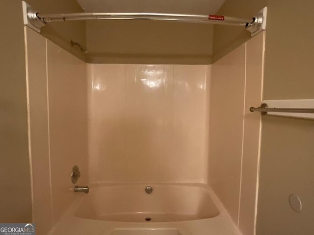 bathroom featuring  shower combination