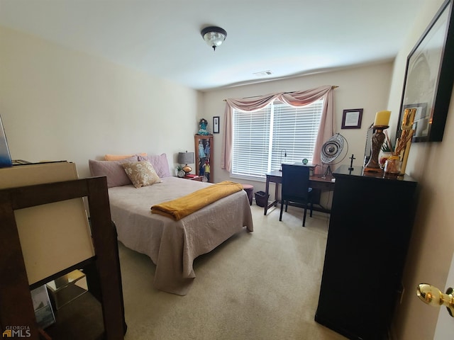 bedroom with light colored carpet and visible vents