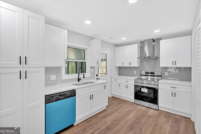 kitchen with wall chimney exhaust hood, stainless steel range with electric stovetop, dishwasher, light countertops, and a sink