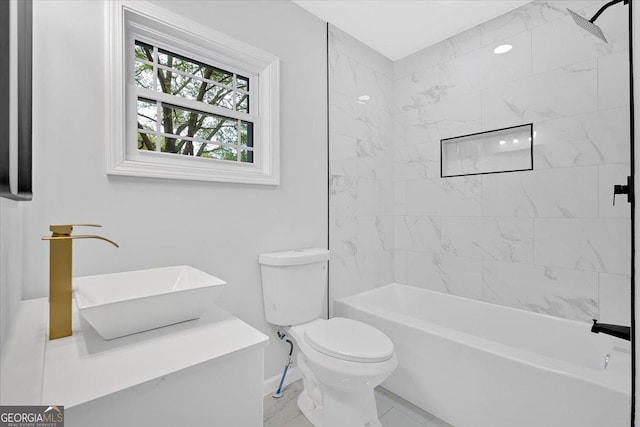 full bath with baseboards, toilet, bathtub / shower combination, marble finish floor, and a sink