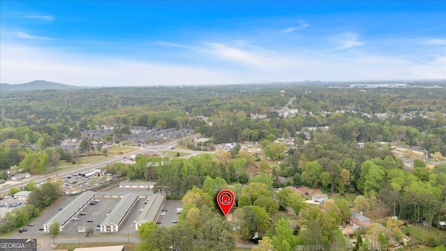 drone / aerial view with a view of trees