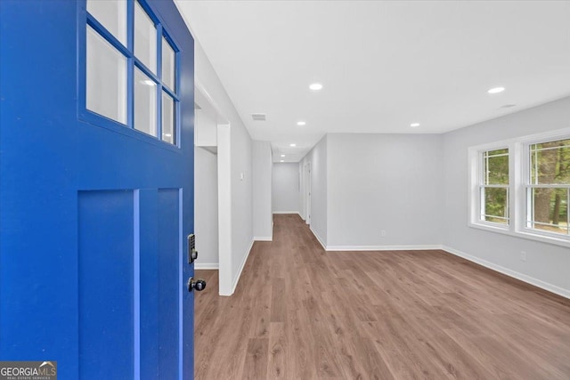 entrance foyer featuring recessed lighting, visible vents, baseboards, and wood finished floors