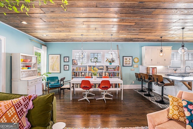 dining area with dark wood-type flooring, baseboards, recessed lighting, and wood ceiling