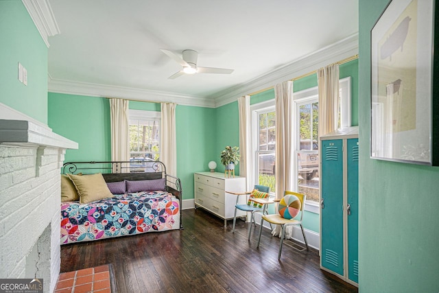 interior space featuring ceiling fan, wood-type flooring, and ornamental molding