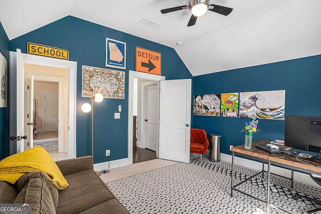 office featuring baseboards, vaulted ceiling, and a ceiling fan