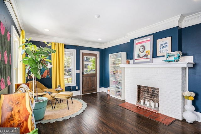 entryway featuring wood finished floors, a fireplace, ornamental molding, and baseboards