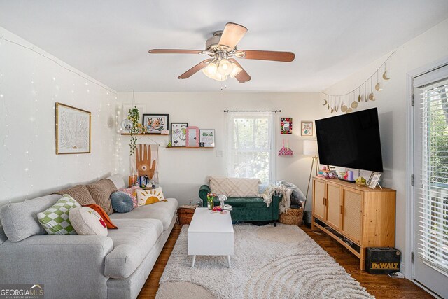 living area featuring wood finished floors and ceiling fan