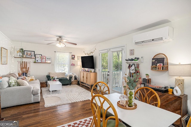 dining area with a healthy amount of sunlight, a wall mounted AC, a ceiling fan, and wood finished floors