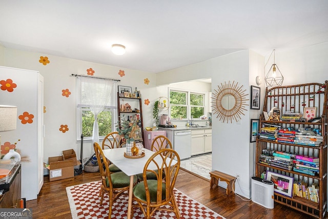 dining room with plenty of natural light and wood finished floors