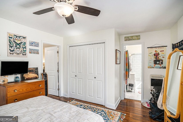 bedroom featuring a closet, baseboards, dark wood-style flooring, ceiling fan, and connected bathroom