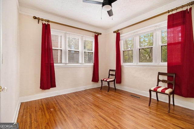 650 Somerset Ter NE, Atlanta, GA 30306 - unfurnished room with wood finished floors, a ceiling fan, and a textured ceiling