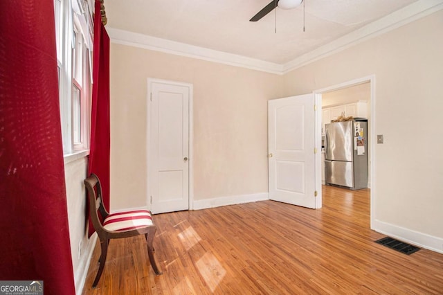 650 Somerset Ter NE, Atlanta, GA 30306 - spare room with light wood-style floors, visible vents, ornamental molding, and ceiling fan