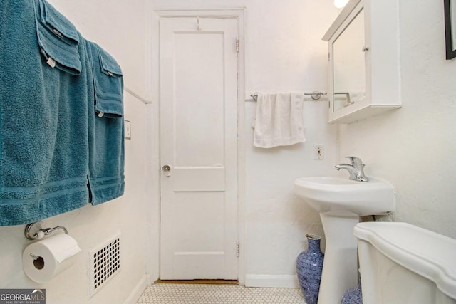 650 Somerset Ter NE, Atlanta, GA 30306 - bathroom with toilet, baseboards, and visible vents