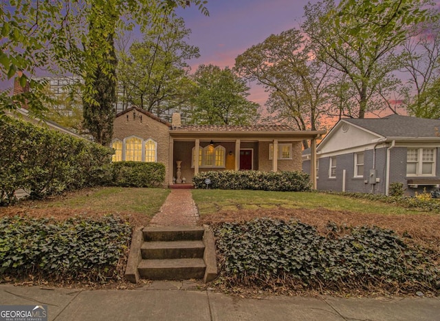 650 Somerset Ter NE, Atlanta, GA 30306 - view of front facade featuring covered porch, a chimney, and a front lawn