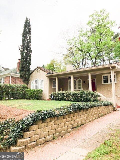 650 Somerset Ter NE, Atlanta, GA 30306 - ranch-style house with a front lawn and stucco siding