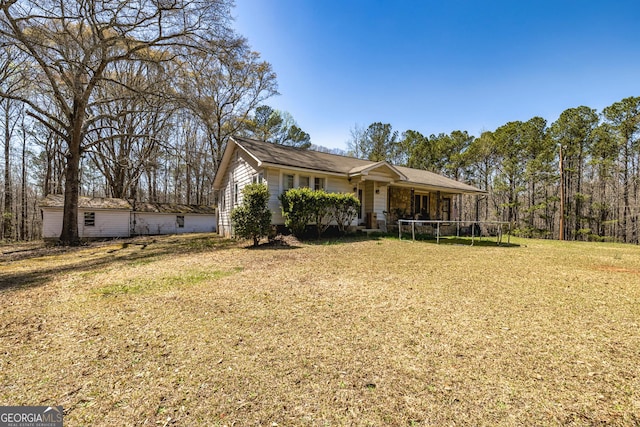 310 Austin Rd, Newnan, GA 30263 - view of front facade with a trampoline and a front lawn