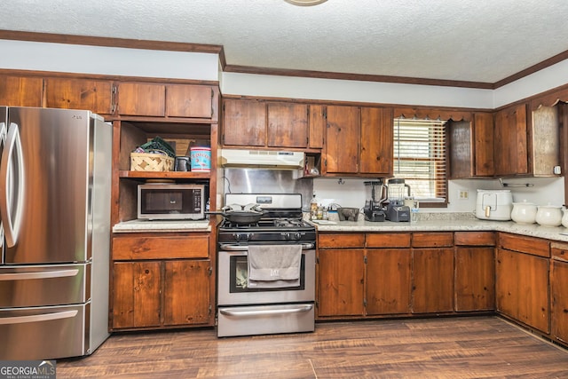 310 Austin Rd, Newnan, GA 30263 - kitchen featuring appliances with stainless steel finishes, under cabinet range hood, a textured ceiling, light countertops, and crown molding