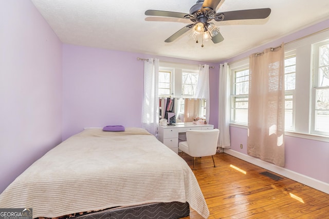 310 Austin Rd, Newnan, GA 30263 - bedroom featuring wood-type flooring, baseboards, and ceiling fan