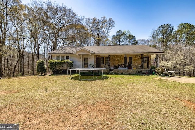 310 Austin Rd, Newnan, GA 30263 - ranch-style home featuring a trampoline and a front lawn
