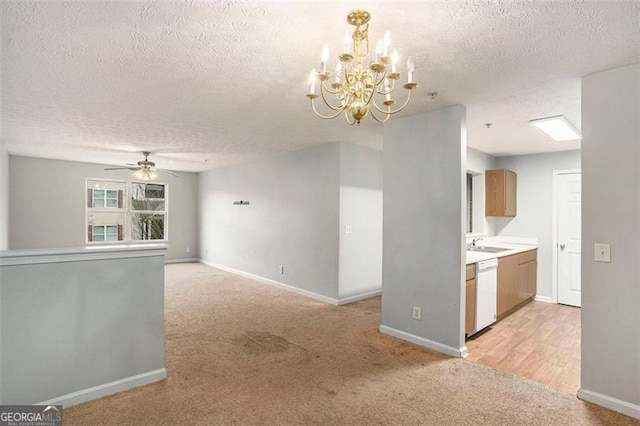 13304 Waldrop Cv, Decatur, GA 30034 - kitchen with a sink, light carpet, white dishwasher, baseboards, and ceiling fan with notable chandelier