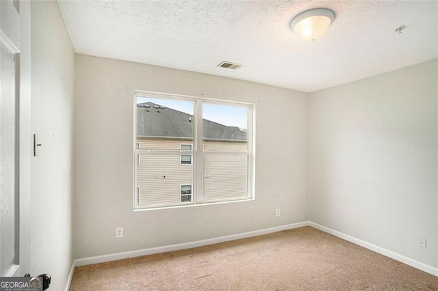 13304 Waldrop Cv, Decatur, GA 30034 - carpeted spare room featuring baseboards, visible vents, and a textured ceiling