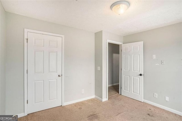 13304 Waldrop Cv, Decatur, GA 30034 - unfurnished bedroom featuring carpet floors, baseboards, and a textured ceiling