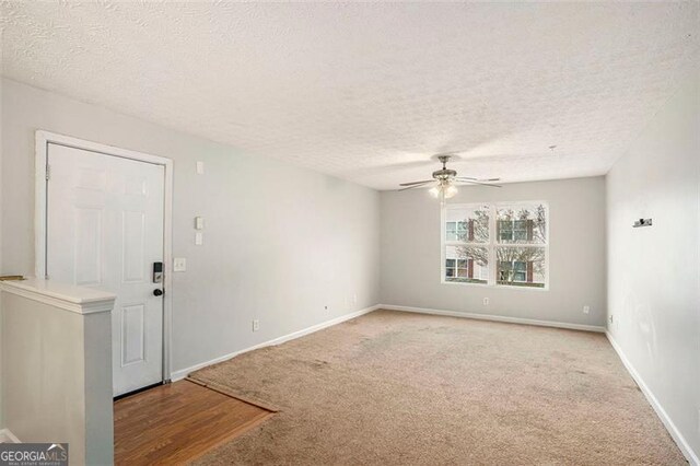 13304 Waldrop Cv, Decatur, GA 30034 - spare room featuring a ceiling fan, baseboards, light colored carpet, and a textured ceiling