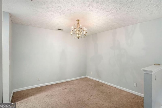 13304 Waldrop Cv, Decatur, GA 30034 - carpeted spare room featuring a textured ceiling, baseboards, a chandelier, and visible vents