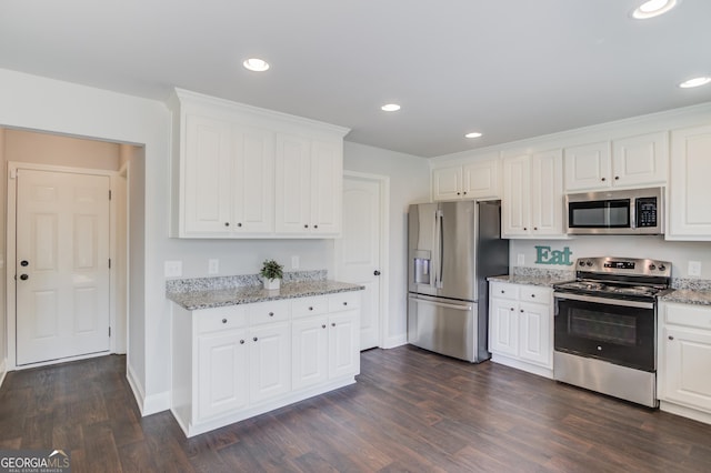 kitchen featuring white cabinets, dark wood-style floors, appliances with stainless steel finishes, and recessed lighting