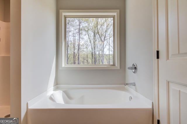 full bath with a garden tub