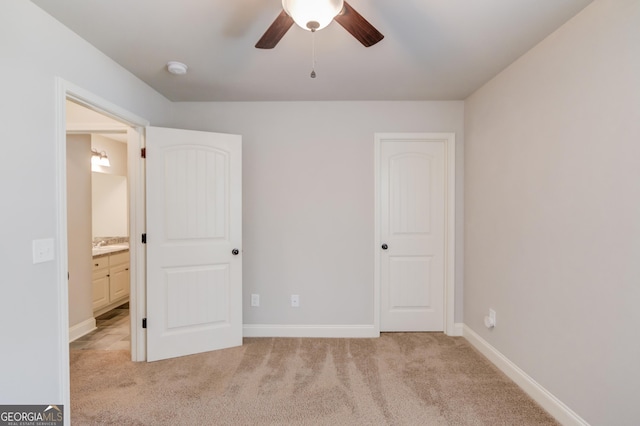 unfurnished bedroom featuring baseboards and carpet floors