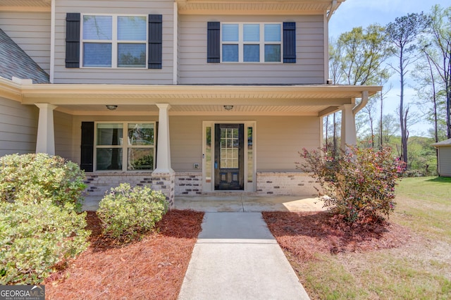 property entrance with covered porch