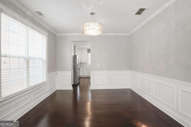 unfurnished dining area with dark wood-style floors, visible vents, a notable chandelier, and ornamental molding