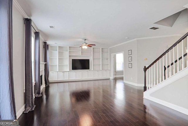unfurnished living room featuring visible vents, baseboards, a fireplace, wood finished floors, and a ceiling fan