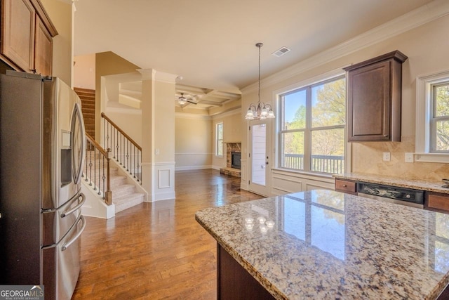 132 Windmeadow Way, Fayetteville, GA 30214 - kitchen with coffered ceiling, stainless steel appliances, light wood finished floors, visible vents, and a fireplace