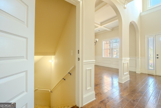 132 Windmeadow Way, Fayetteville, GA 30214 - staircase featuring coffered ceiling, beam ceiling, wood finished floors, wainscoting, and a decorative wall
