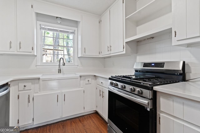 2199 Summertown Dr, Norcross, GA 30071 - kitchen featuring appliances with stainless steel finishes, a sink, and white cabinetry