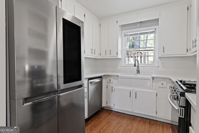 2199 Summertown Dr, Norcross, GA 30071 - kitchen featuring appliances with stainless steel finishes, light countertops, and white cabinets