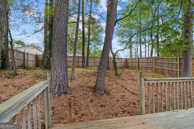 2199 Summertown Dr, Norcross, GA 30071 - fenced backyard featuring a wooden deck