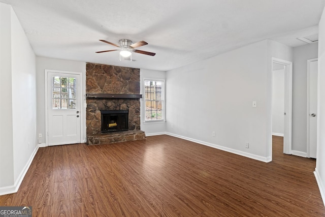 2199 Summertown Dr, Norcross, GA 30071 - unfurnished living room featuring a ceiling fan, dark wood-style flooring, baseboards, and healthy amount of natural light