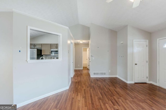 interior space with visible vents, wood finished floors, and lofted ceiling