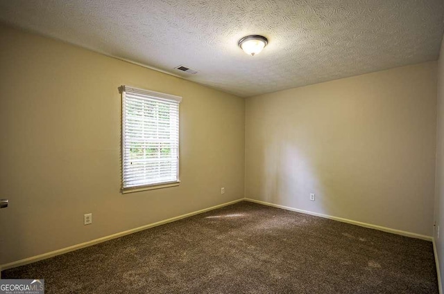 2048 Kelvin Dr, Lawrenceville, GA 30043 - spare room featuring dark carpet and a textured ceiling
