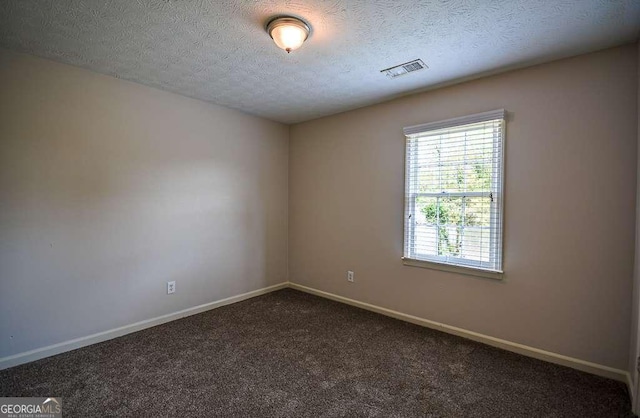 2048 Kelvin Dr, Lawrenceville, GA 30043 - carpeted empty room featuring baseboards and a textured ceiling